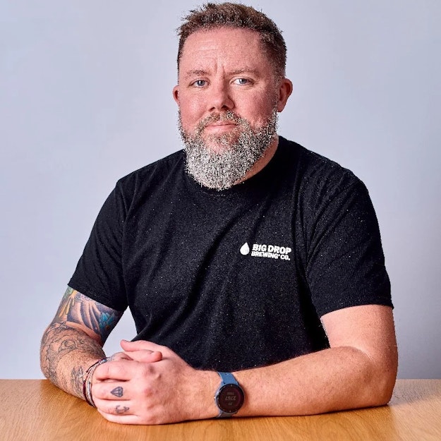 James Kindred sitting at a table